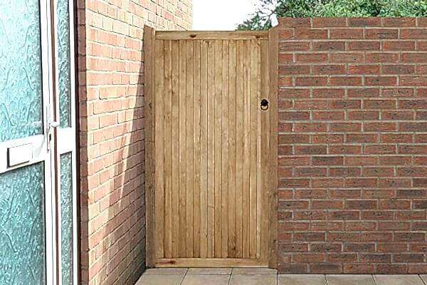 a photo of a wooden side gate which is one of the gate types in our list of types of garden gates