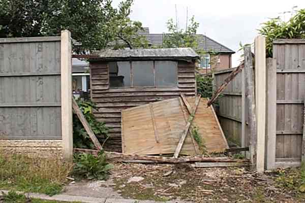 image of a storm damaged fence