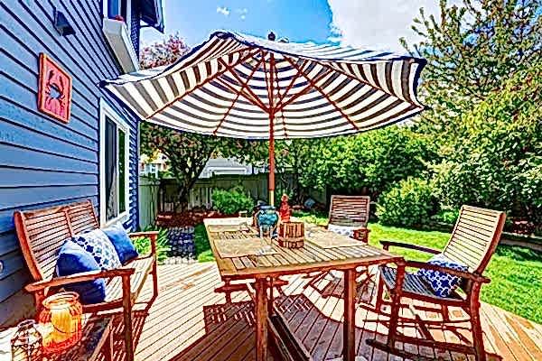 This image shows one of our best decking ideas that brings to mind questions such as deck vs patio, deck versus patio, decks or patios and decking vs patio
