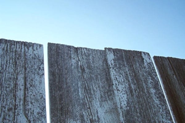 a photo of a fence that needs replacing, important considerations before replacing a fence are which fence is mine, which side of the fence is mine, how do I know which fence is mine, how do I find out which fence is mine and which boundary fence is mine