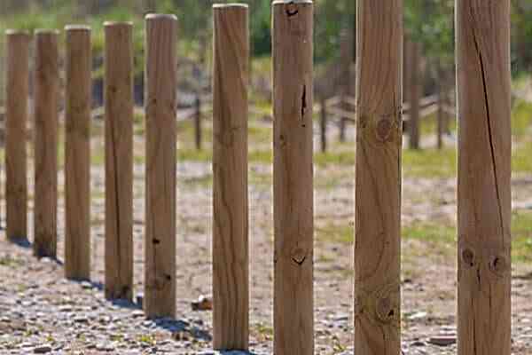 This image shows a stage in installing fence posts. To do this you will need to know how to install fence posts, how to install a fence post and how to set fence posts