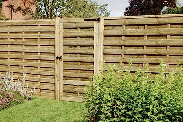 a photo showing a natural wooden fence designs - one of our fence design ideas
