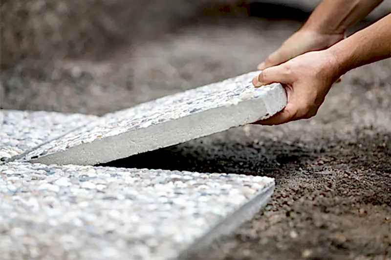 Laying a paving slab shed base
