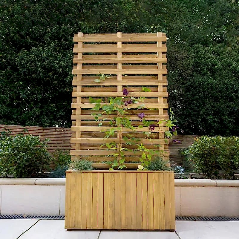 a photo showing a fencing run with some wonderful fence landscaping from our list of simple fence line landscaping ideas including the best plants for fence lines