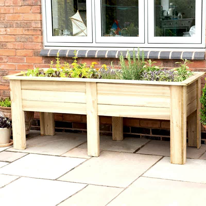 A Forest Large Kitchen Garden Wooden Planter on a patio
