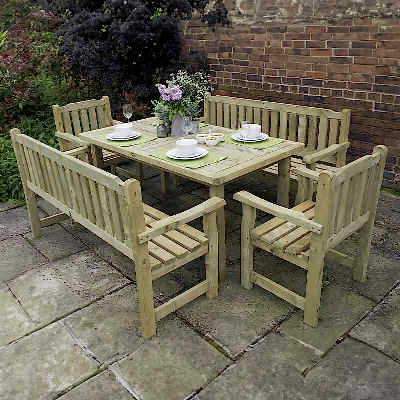 A Forest Rosedene Wooden Garden dining set with a table, benches and chairs on a patio