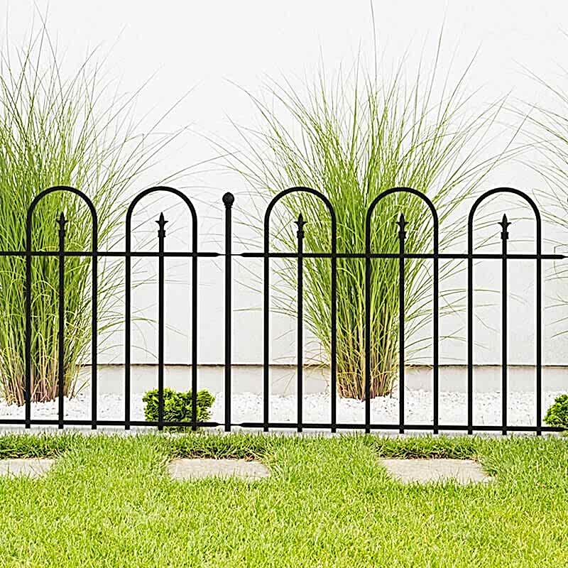 Panacea 4' x 3' Triple Arch Black Metal Fence Panel with green plants, a lawn and paving slabs