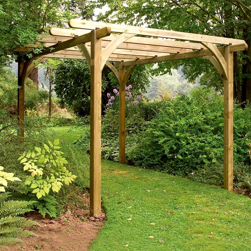 The Forest Ultima Wooden Garden Pergola on a lawn, between two flower beds