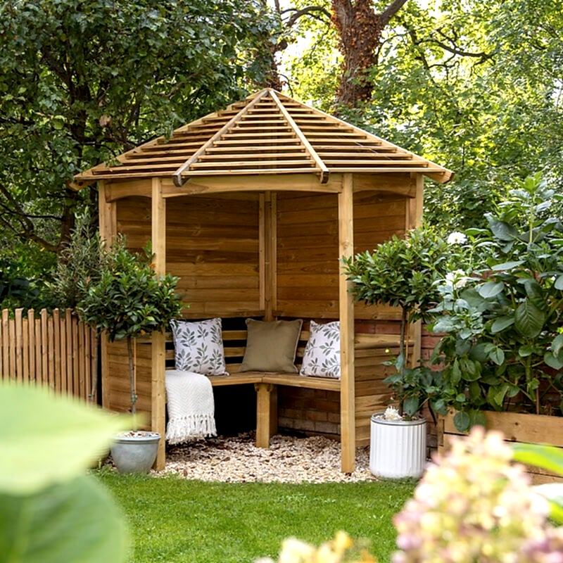 The Forest Venetian Corner Garden Arbour Seat, with a slatted wood roof and wooden seat
