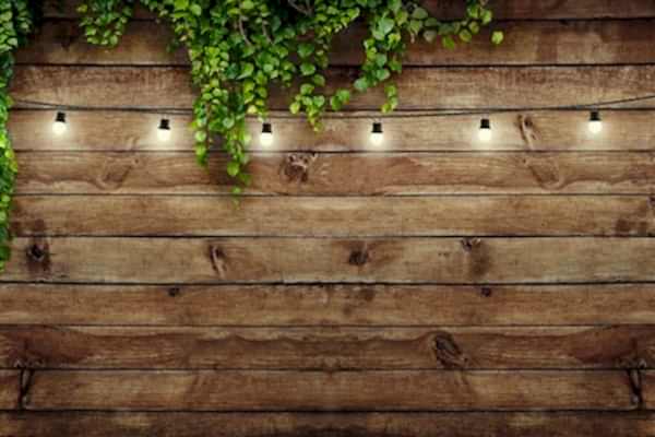 this garden makeover on a budget has been done with affordable garden plants, inexpensive garden fencing and DIY garden planters