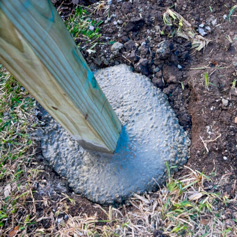This image shows a stage in installing fence posts. To do this you will need to know how to install fence posts, how to install a fence post and how to set fence posts