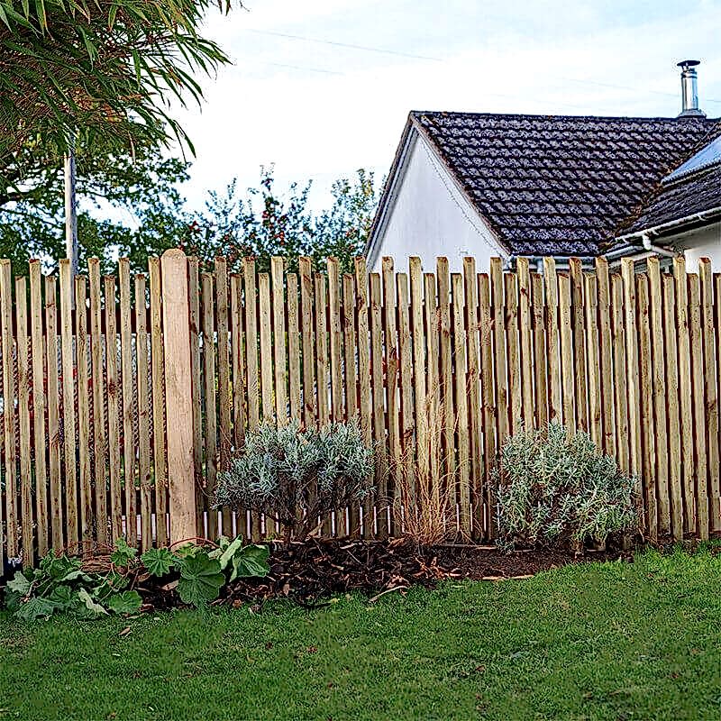 a contemporary picket fence - opting for standard panels over decorative ones will bring down fence installation costs