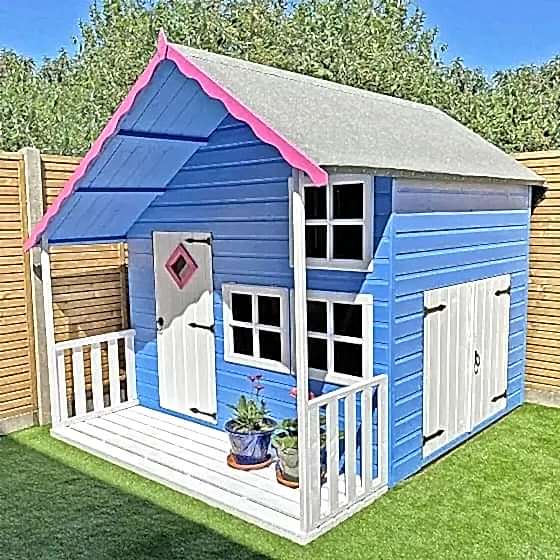 this image shows one of our outdoor play ideas which include a play area in the garden, garden play area ideas, playhouse ideas and garden playground ideas