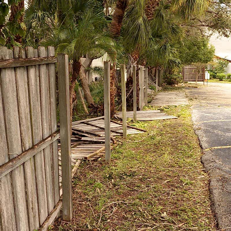 a photo showing a fence exhibiting hail damage, fence hail damage and hail damage to a wooden fence