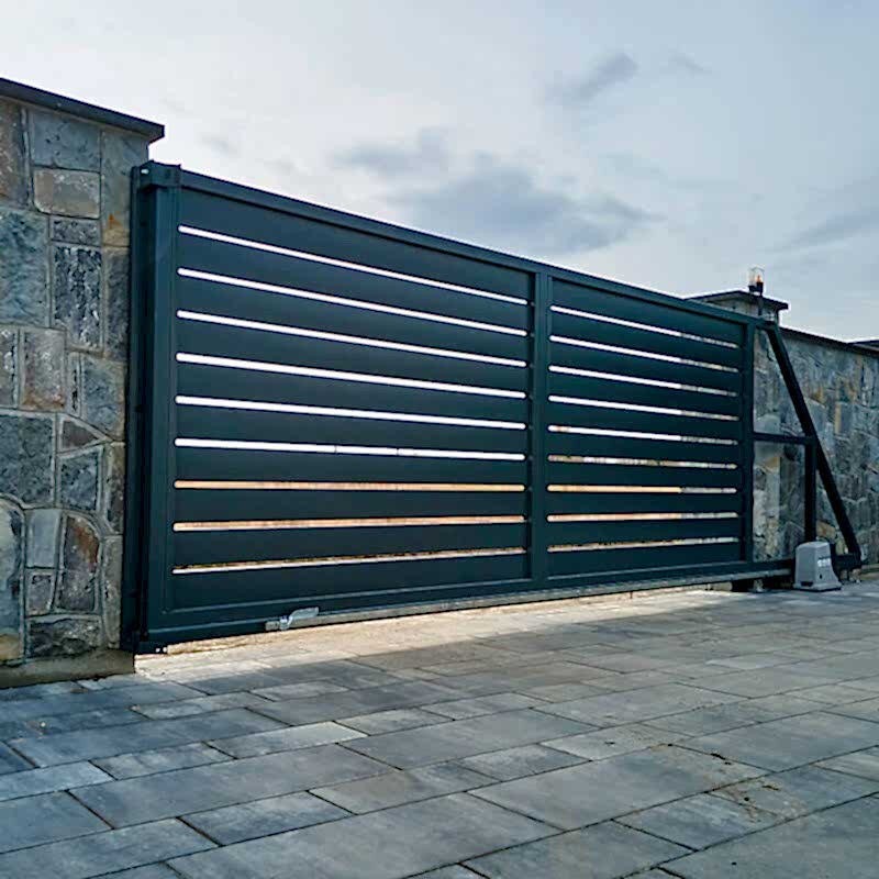 a photo of a metal driveway gate which is one of the gate types in our list of types of garden gates