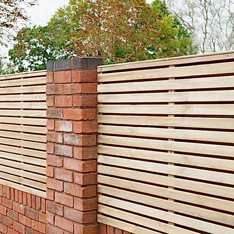 slatted fencing mounted on brick wall