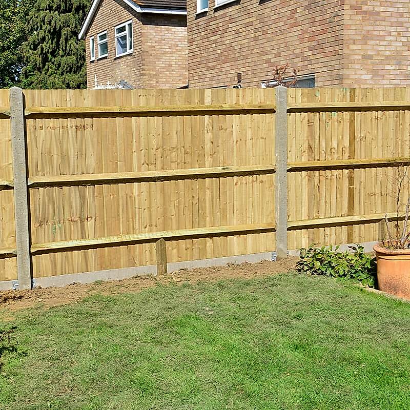 run of wooden fencing with concrete gravel boards and fence posts