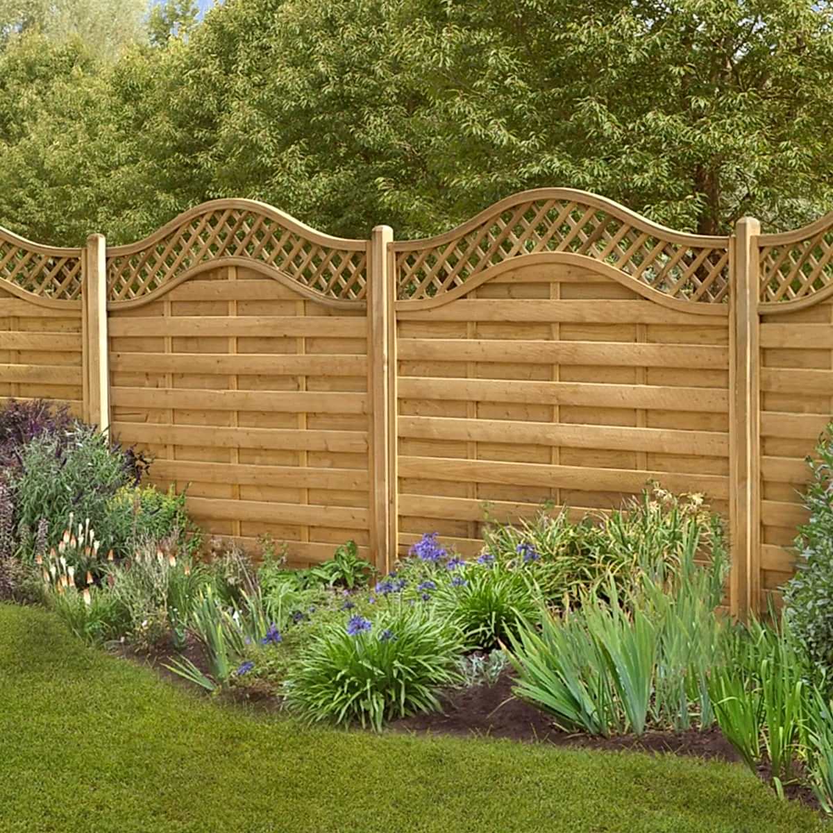 a photo showing a fencing run with some wonderful fence landscaping from our list of simple fence line landscaping ideas including the best plants for fence lines