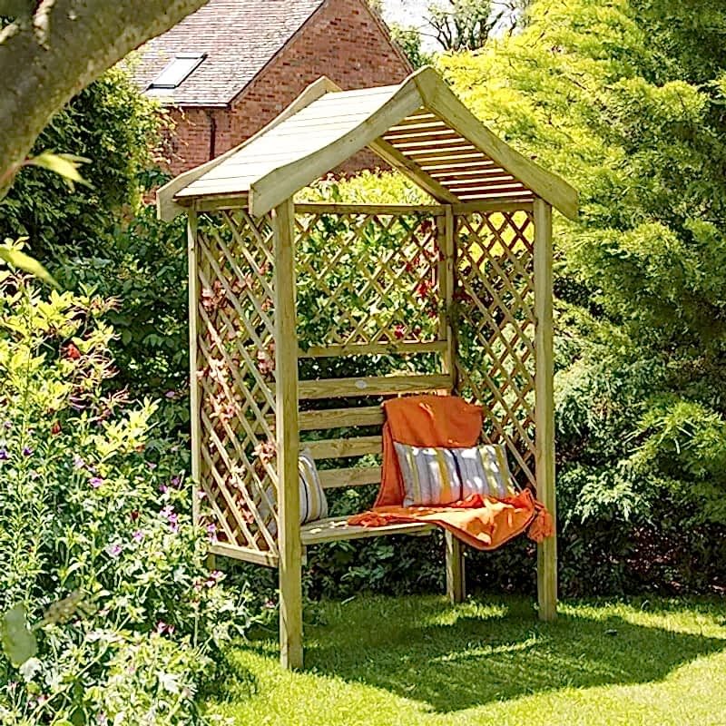 a photo showing a fencing run with some wonderful fence landscaping from our list of simple fence line landscaping ideas including the best plants for fence lines