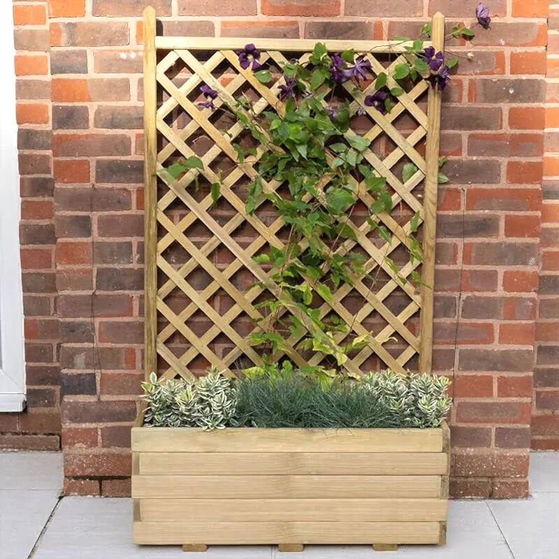 this garden makeover on a budget has been done with affordable garden plants, inexpensive garden fencing and DIY garden planters