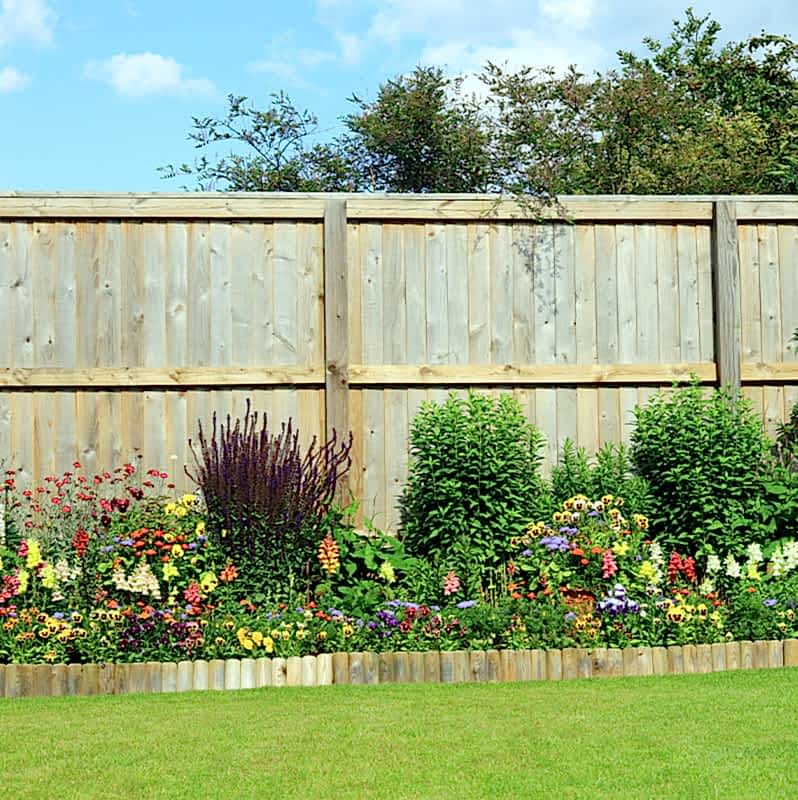 this pristine run of fencing is not in need of fixing a fence or fence panel replacement