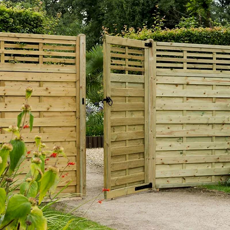 a photo of a wooden side gate which is one of the gate types in our list of types of garden gates