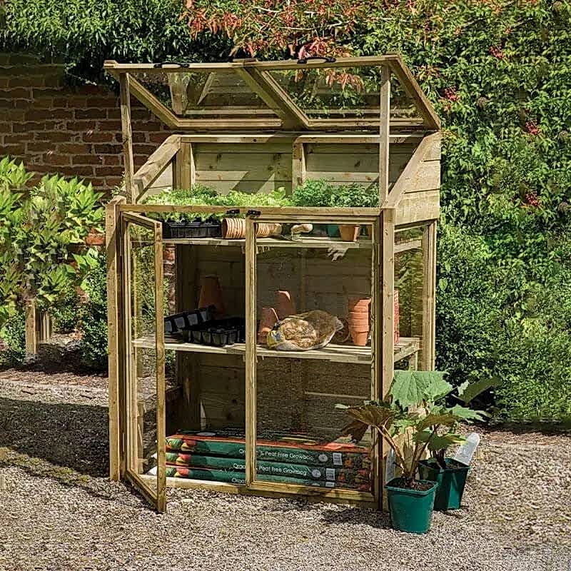 this image shows one of our outdoor play ideas which include a play area in the garden, garden play area ideas, playhouse ideas and garden playground ideas