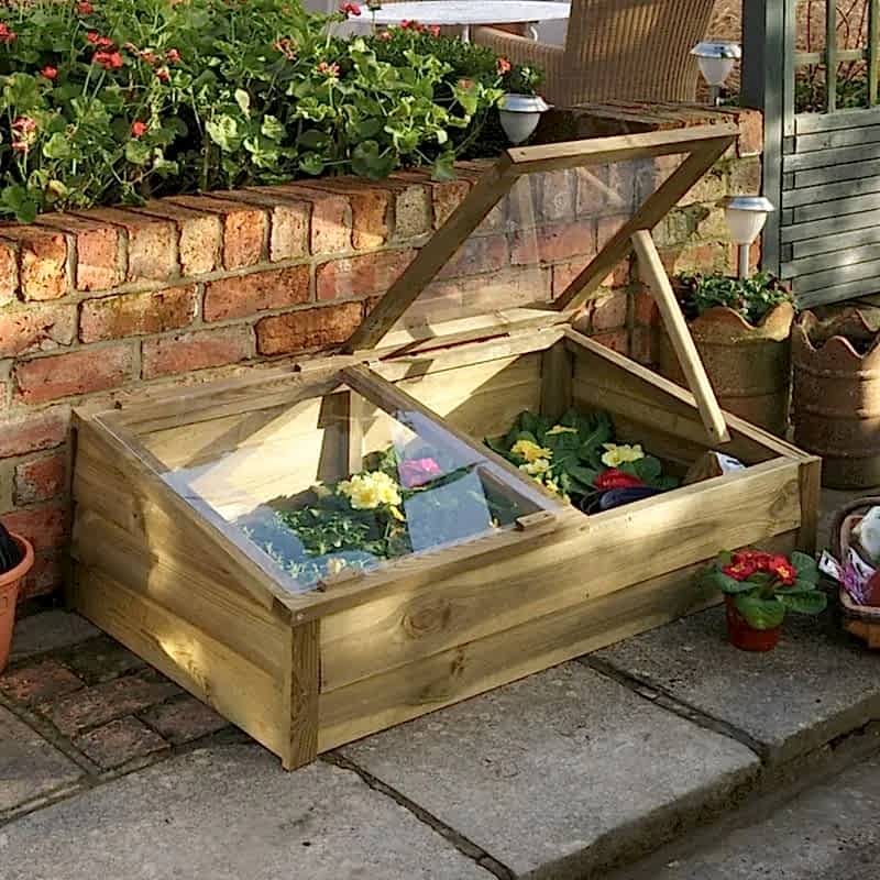 this image shows one of our outdoor play ideas which include a play area in the garden, garden play area ideas, playhouse ideas and garden playground ideas