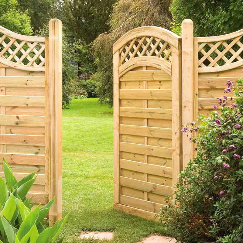 a photo of a wooden side gate which is one of the gate types in our list of types of garden gates