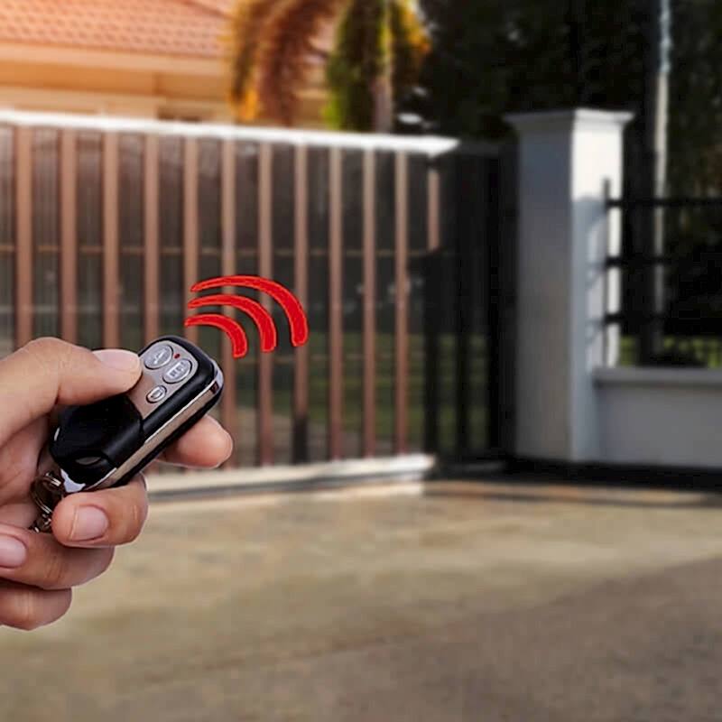 a photo of an automated metal driveway gate which is one of the gate types in our list of types of garden gates