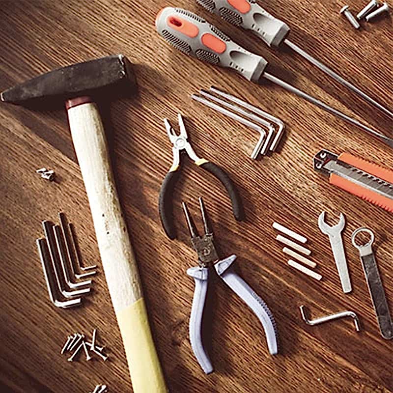 a selection of tools needed for fence post installation
