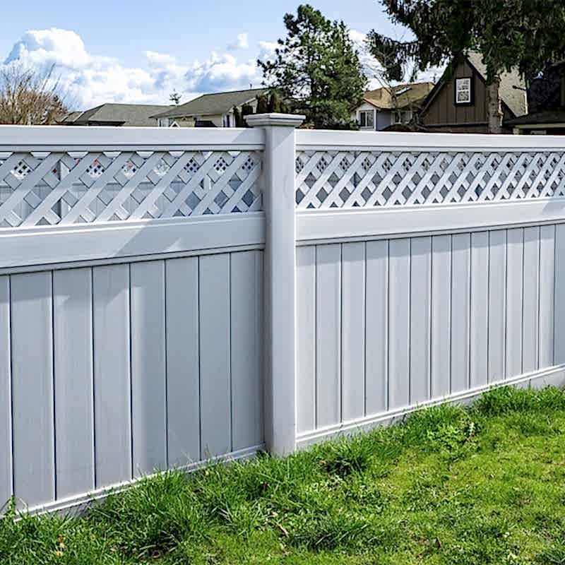 a white fence is one of our small garden fencing ideas