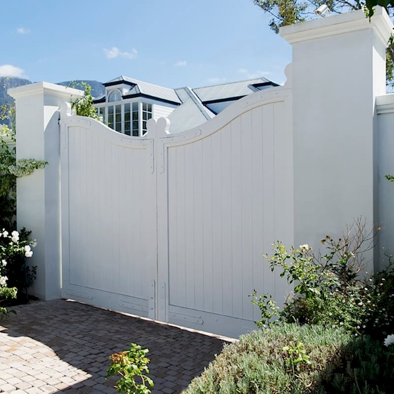 a photo of a driveway gate which is one of the gate types in our list of types of garden gates