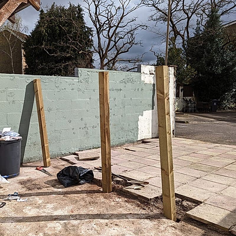 photo of an in-progress fence post installation