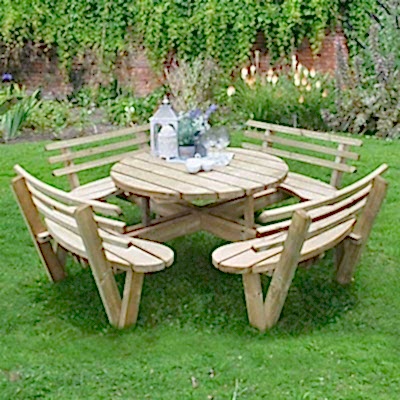 a circular wooden garden picnic table with picnic benches