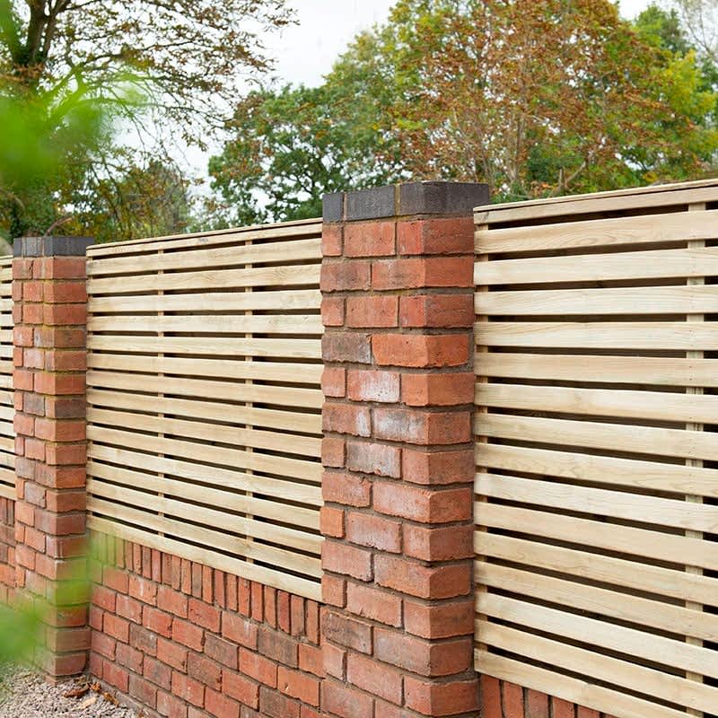 Double slatted fencing on a wall
