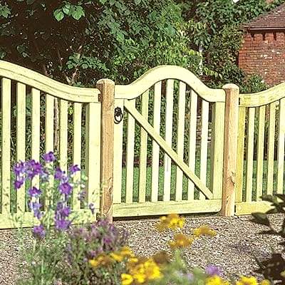 a 3x3 modern picket gate with a scalloped top and gaps between the vertical slats